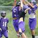 Pioneer High School players reach for a pass during the first day of practice on Monday, August 12, 2013. Melanie Maxwell | AnnArbor.com